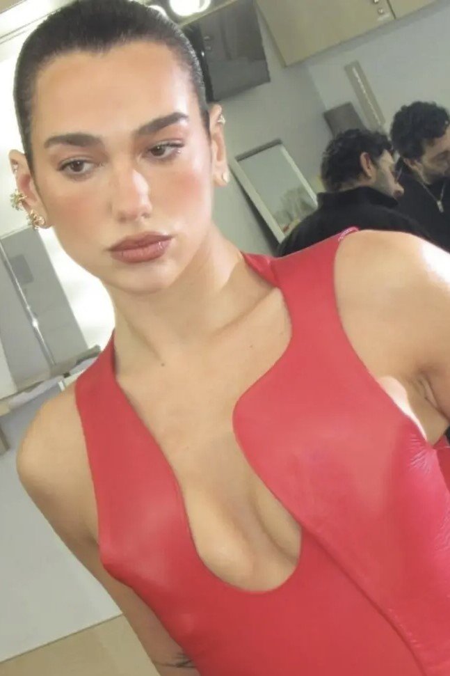 Dua Lipa Stuns While Showing Off Her Assets in Red Leather Dress Photos